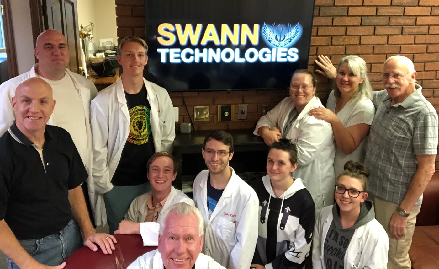 Electronics work area with tools and components at Swann Technologies